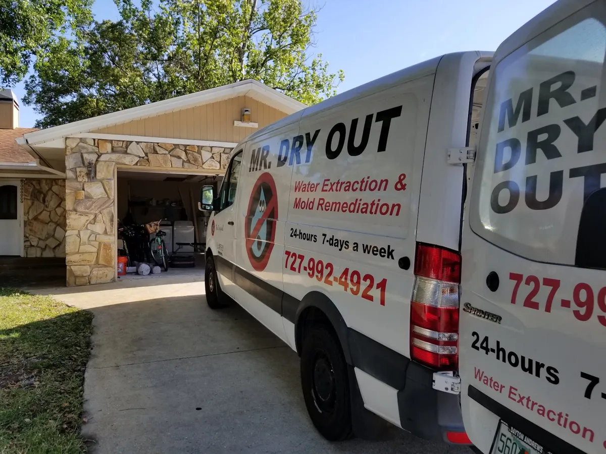Mr. Dry Out water extraction van parked at a customer's home