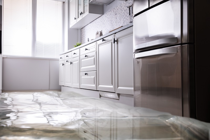 Flooded kitchen floor from a water leak in a Tampa Bay home